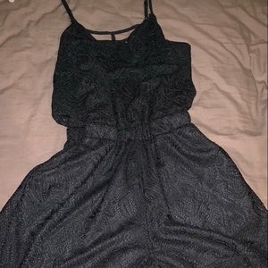 Black, laced short romper.